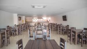 a room full of tables and chairs in a restaurant at Hotel G Cartagena in Cartagena de Indias +35 photos