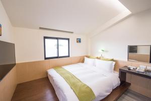 Letto o letti in una camera di Shangri Longluan Lake One B&B