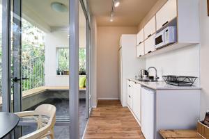 Kuchyň nebo kuchyňský kout v ubytování Hanasi 129 - Boutique Apartments