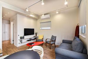 TV a/nebo společenská místnost v ubytování Hanasi 129 - Boutique Apartments