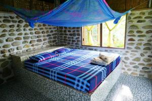 Llit o llits en una habitació de Rattana Bungalow Koh Chang