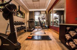 a gym with a treadmill and exercise equipment at Garden Court Eastgate in Johannesburg