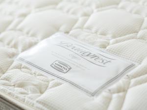 Postel nebo postele na pokoji v ubytování Tosei Hotel Cocone Kanda