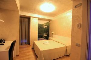 Letto o letti in una camera di I Rocchi Hotel
