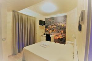 Letto o letti in una camera di I Rocchi Hotel