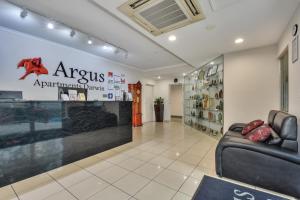 a waiting room with a leather couch and a pharmacy at Argus Apartments Darwin in Darwin +37 photos