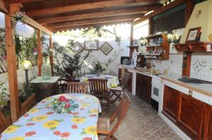 a kitchen with a table with flowers on it at Villa Maddalusa in Agrigento