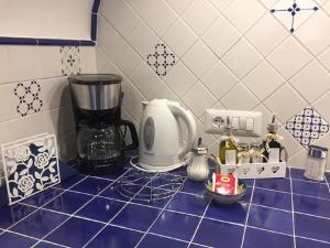 a kitchen counter with a blender on a blue counter top at Casa Rosetta in Praiano