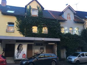 a house with cars parked in front of it at Ferienwohnung Rumpf**** in Volkmarsen