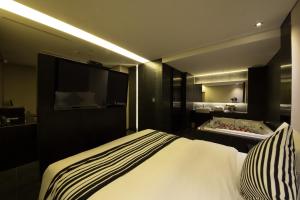 Cama o camas de una habitación en Hotel Adlige