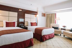 Postel nebo postele na pokoji v ubytování Golden Tulip Addis Ababa
