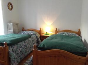 Un ou plusieurs lits dans un hébergement de l'établissement Appartamenti Zecchini