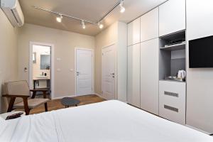 TV a/nebo společenská místnost v ubytování Hanasi 129 - Boutique Apartments