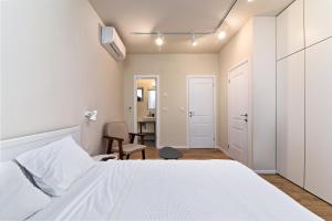 Postel nebo postele na pokoji v ubytování Hanasi 129 - Boutique Apartments
