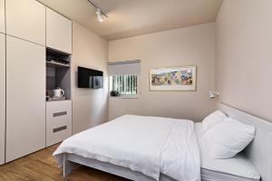 Postel nebo postele na pokoji v ubytování Hanasi 129 - Boutique Apartments