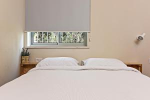 Postel nebo postele na pokoji v ubytování Hanasi 129 - Boutique Apartments