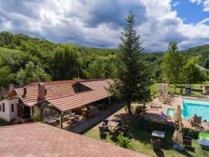 an overhead view of a house with a swimming pool at Nomad Hotel & Glamping in Noszvaj