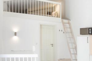 a room with a staircase and a white door at Möwennest in Flensburg