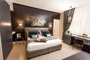 Postel nebo postele na pokoji v ubytování Delle Vittorie Luxury Rooms&Suites