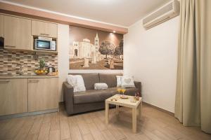 a living room with a couch and a table at Holiday Center Ivona in Zadar