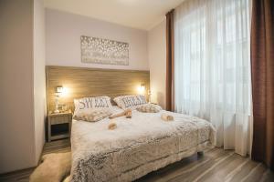 Postel nebo postele na pokoji v ubytování Holiday Center Ivona