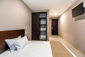 Postel nebo postele na pokoji v ubytování Ribai Hotels - Barranquilla