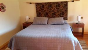 Postel nebo postele na pokoji v ubytování La Casa de Carlitos