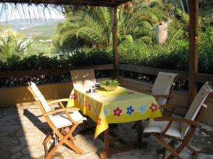 a table and chairs on a patio with a view at Villa Annoula in Sami