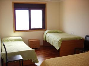 Vivienda de uso turístico Vista Alegre tesisinde bir odada yatak veya yataklar