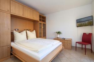 Postel nebo postele na pokoji v ubytování Hotel Bergmühle