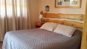 Postel nebo postele na pokoji v ubytování La Casa de Carlitos