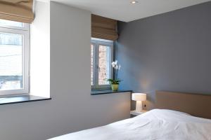 Postel nebo postele na pokoji v ubytování Le Coeur de Durbuy