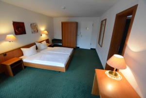 Postel nebo postele na pokoji v ubytování Hotel Evabrunnen + 37 fotografií