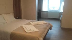 Postel nebo postele na pokoji v ubytování Guesthouse Nikolić + 4 fotografie