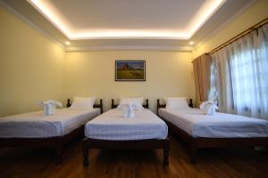 Rúm í herbergi á Bagan View Hotel