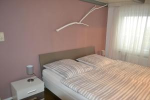 Posteľ alebo postele v izbe v ubytovaní Haus-Willkommen-EG-1