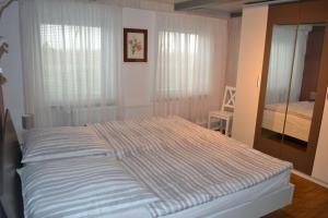 Posteľ alebo postele v izbe v ubytovaní Haus-Willkommen-EG-1