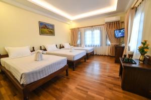Rúm í herbergi á Bagan View Hotel
