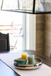 a tray with two candles on a table at Lastølen 3 bedrooms in Brunstad