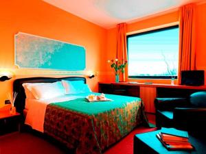 Postel nebo postele na pokoji v ubytování Hotel Bifi
