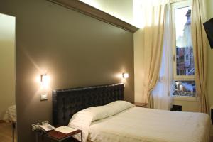 เตียงในห้องที่ Albergo al Tiepolo