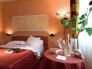 Postel nebo postele na pokoji v ubytování Hotel Bifi
