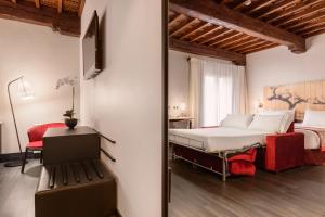 מיטה או מיטות בחדר ב-Eurostars Fuerte Ruavieja