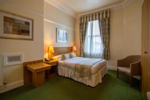 Ένα ή περισσότερα κρεβάτια σε δωμάτιο στο A Park View Hotel