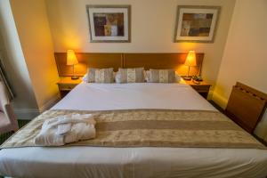 Ένα ή περισσότερα κρεβάτια σε δωμάτιο στο A Park View Hotel