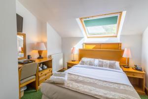 Ένα ή περισσότερα κρεβάτια σε δωμάτιο στο A Park View Hotel