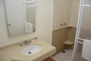 a bathroom with a sink and a shower at Lourdes Hotel Campestre in Tierranueva +84 photos