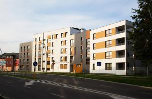 a building on the side of a street at 100-SIO Apartamenty Budget I in Koszalin