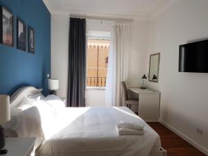 Posteľ alebo postele v izbe v ubytovaní More Cola di Rienzo B&B