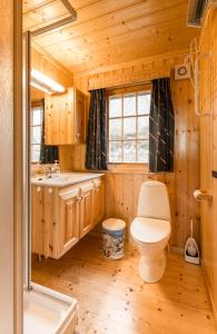 a bathroom with a toilet and a sink at Sjåfram in Stranda